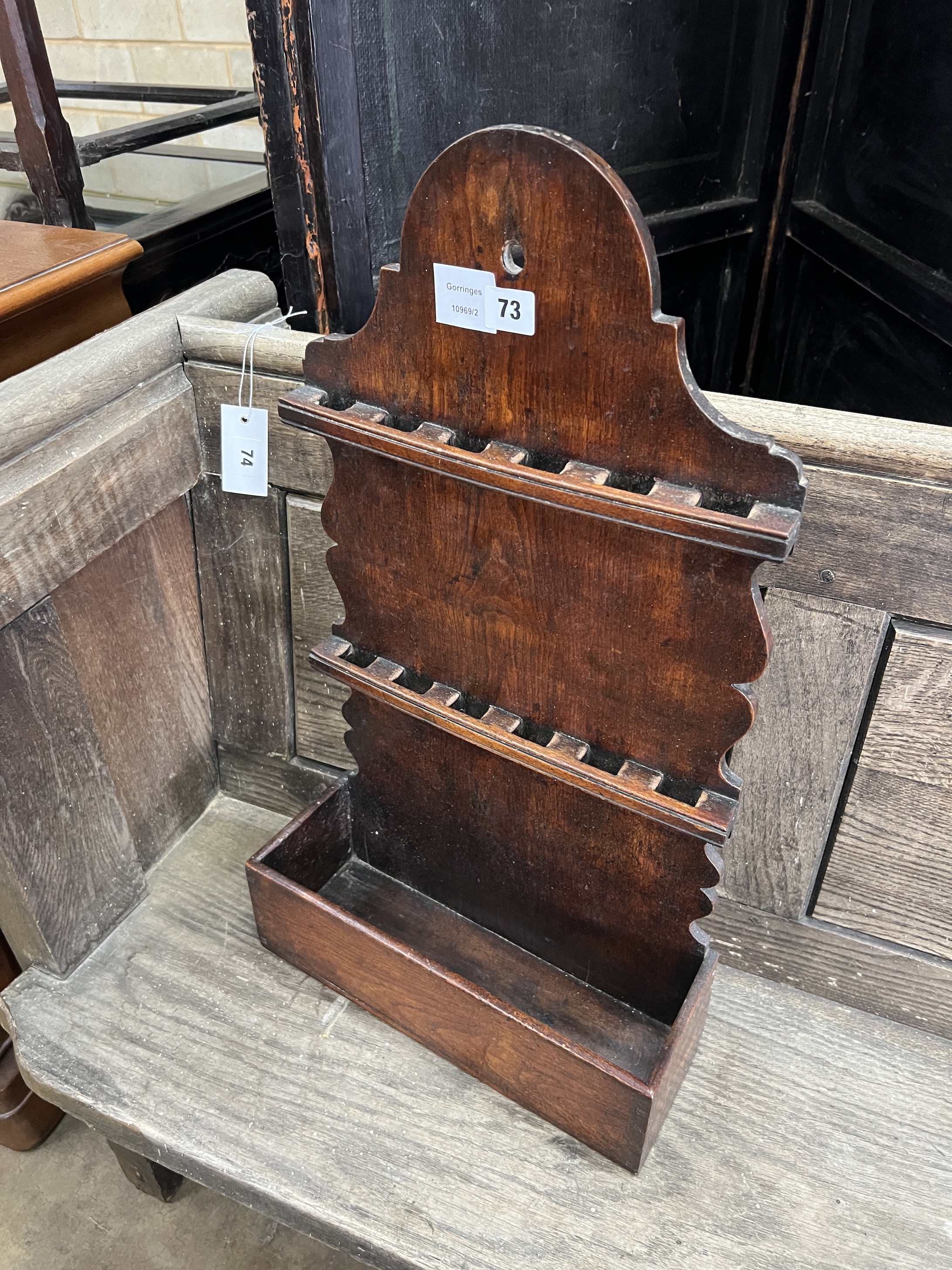 An 18th century oak spoon rack, width 35cm, depth 13cm, height 63cm